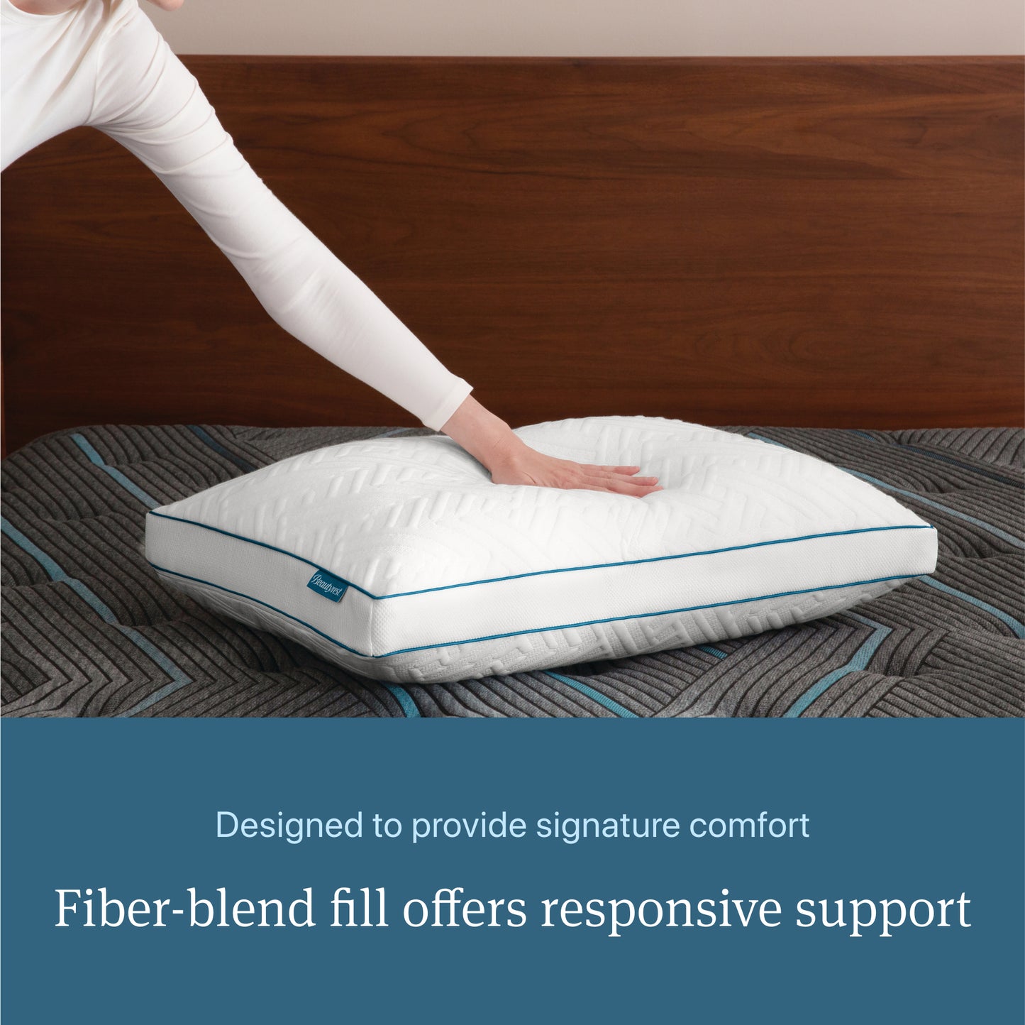 Woman pressing her hand on a Beautyrest Down Alternative Pillow