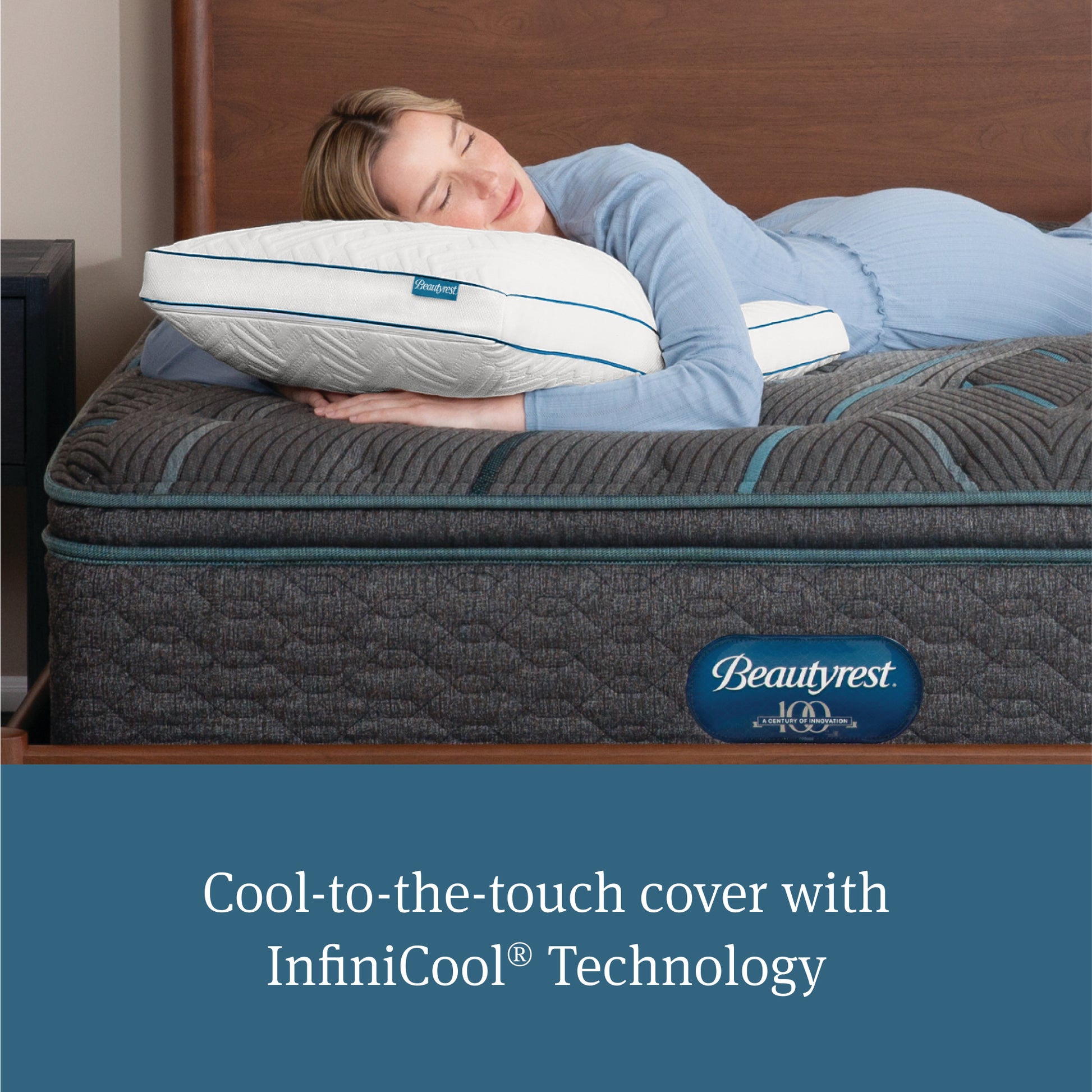 Woman laying on her stomach asleep with her head on a Beautyrest Down Alternative Pillow