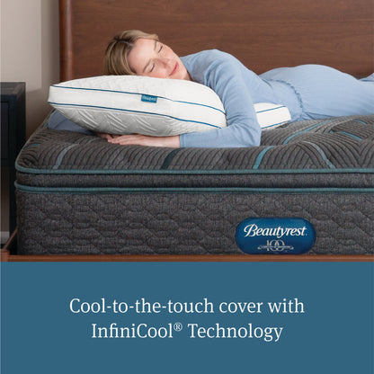 Woman laying on her stomach asleep with her head on a Beautyrest Down Alternative Pillow