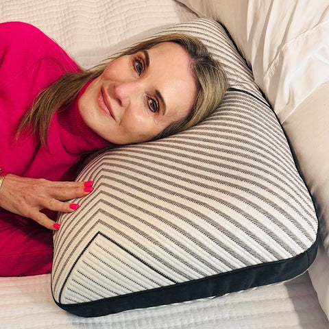 Dr. Caroline Leaf laying on a Beautyrest Black Luxury foam pillow