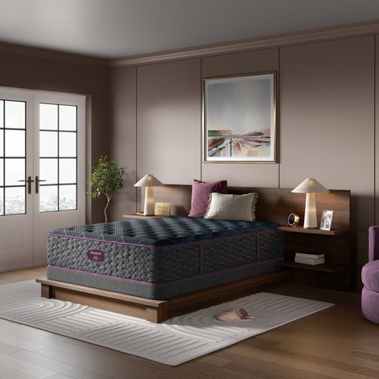 Beautyrest Mattress on a wooden bed frame in a bedroom setting with decor elements on top of a low profile 5.5" flat foundation